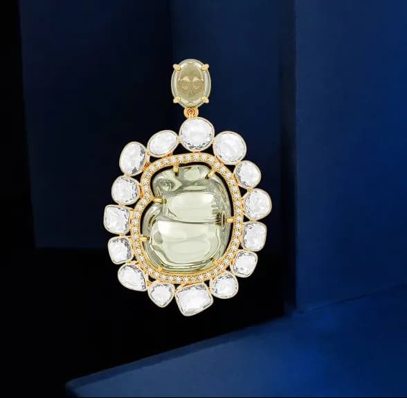 Diamond drop earrings in white and yellow gold